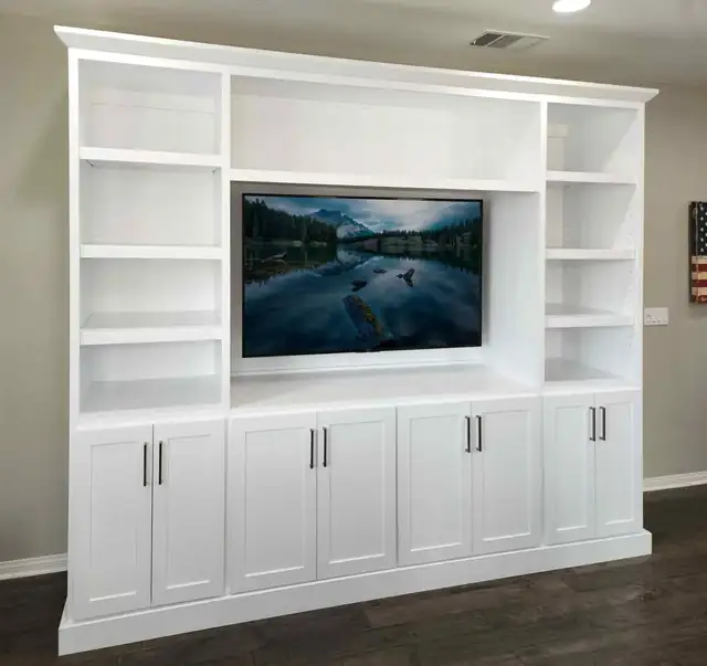 Custom white Shaker entertainment center with open side shelving built for a Temecula client
